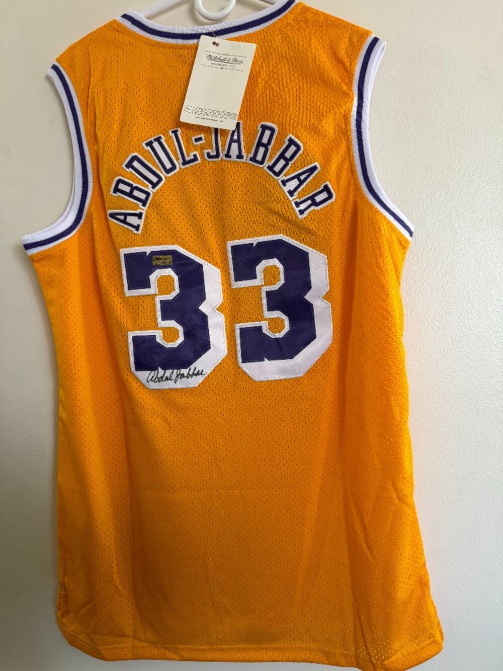 This is a new w/tags autographed Mitchell & Ness jersey signed by Kareem Abdul J